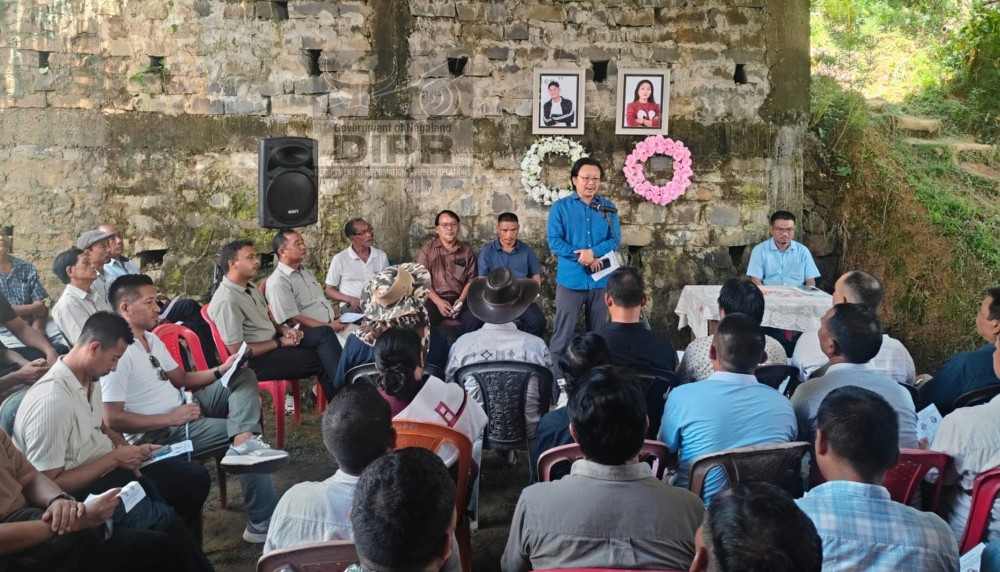 DC Wennyei Konyak addresses the gathering during the mass funeral service held in Mon Town on July 25. (DIPR Photo)